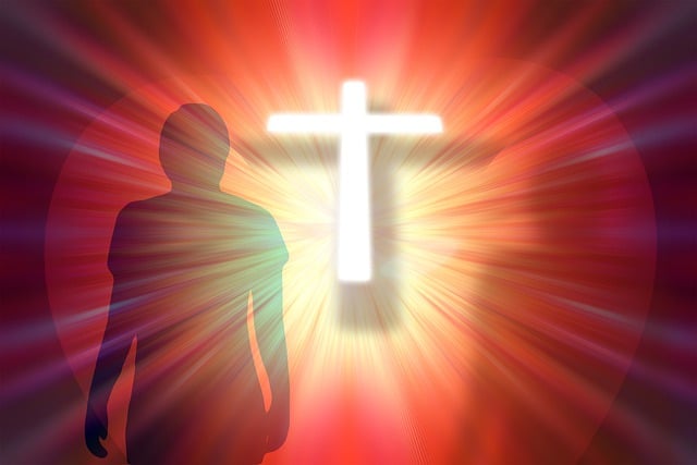 A silhouette of a man standing before a large cross against a sunset backdrop, symbolizing faith and reflection.